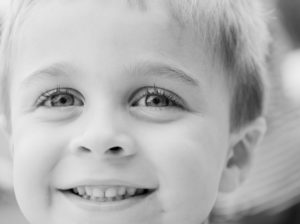 example of good pediatric health care of little boy with healthy smile